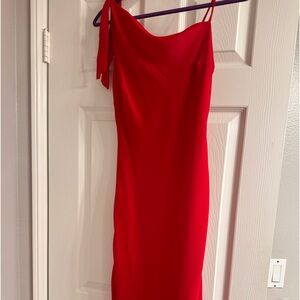 Vintage red dress by Jonathan Martin features one shoulder strap with tie.